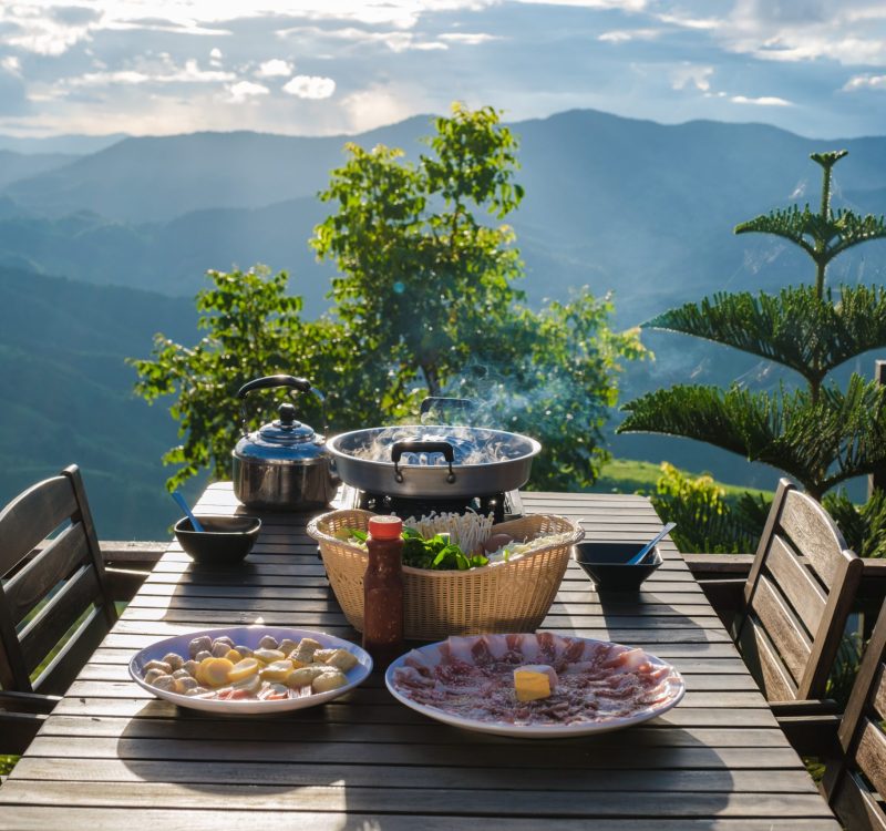 dinner with a Thai BBQ at sunset in the mountains of Doi Chang Chiang Rai Thailand